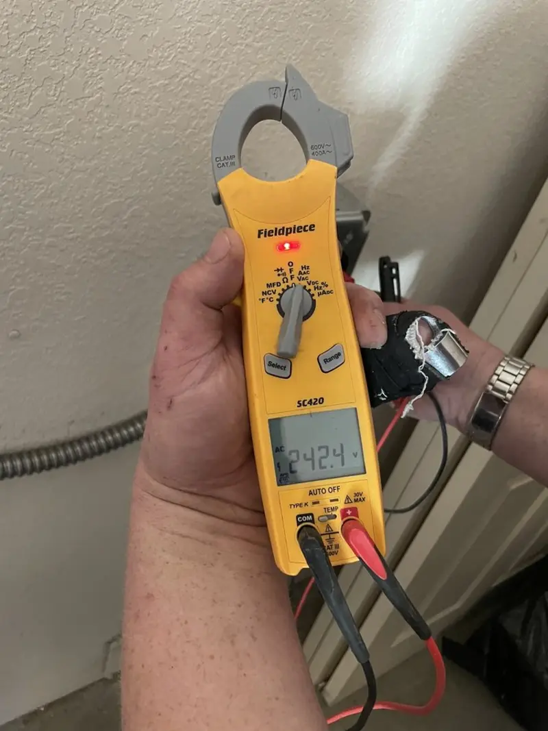 Voltage testing with clamp meter during Outlet Installation in San Joaquin